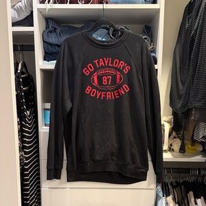 Bella Canvas Black Sweatshirt with Red 'Go Taylor's Boyfriend' Graphic